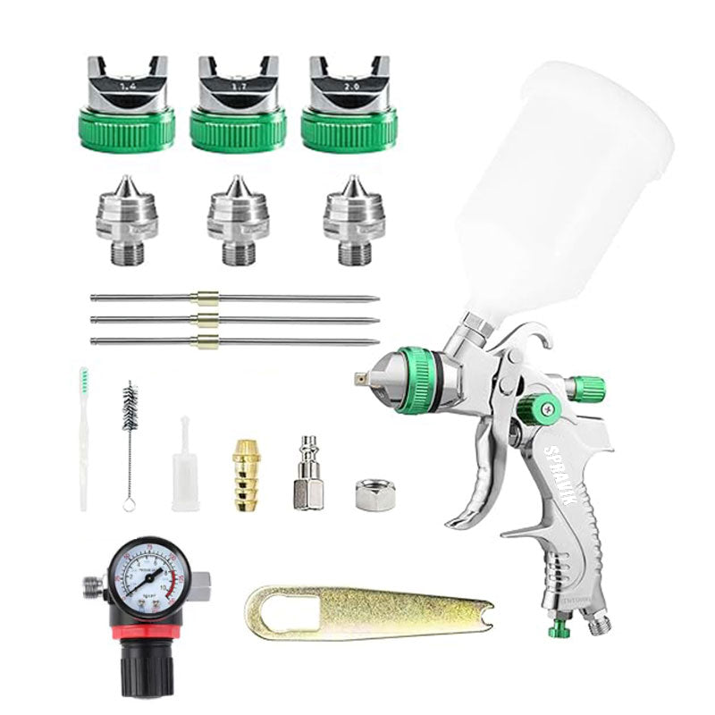 Spray gun with various nozzles and attachments on a white background